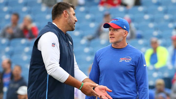 Oct 7, 2018; Orchard Park, NY, USA; Tennessee Titans head coach Mike Vrabel (left) talks with Buffalo Bills head coach Sean McDermott (right).