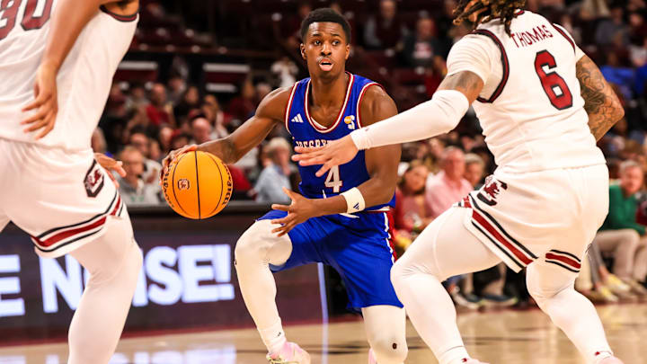 Dec 30, 2024; Columbia, South Carolina, USA; Presbyterian Blue Hose guard Kory Mincy (4) drives against the South Carolina Gamecocks in the second half at Colonial Life Arena. Mandatory Credit: Jeff Blake-Imagn Images