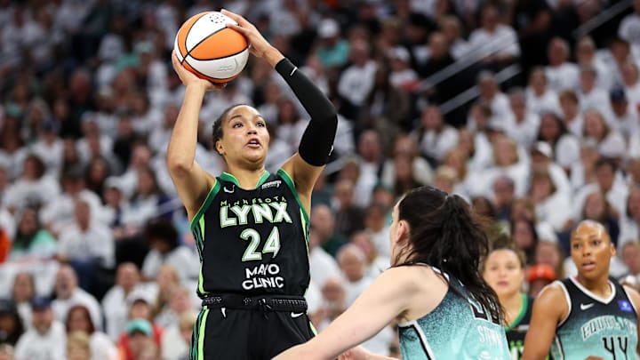 Oct 18, 2024; Minneapolis, Minnesota, USA; Minnesota Lynx forward Napheesa Collier (24) shoots over New York Liberty forward Breanna Stewart (30) during the first half of game four of the 2024 WNBA Finals at Target Center. Mandatory Credit: Matt Krohn-Imagn Images