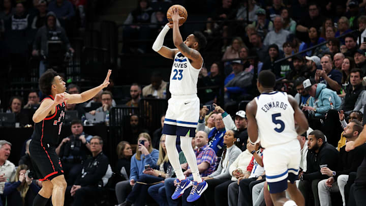 Apr 3, 2024; Minneapolis, Minnesota, USA; Minnesota Timberwolves guard Monte Morris (23) shoots against the Toronto Raptors as time expires in the third quarter at Target Center. Mandatory Credit: Matt Krohn-USA TODAY Sports