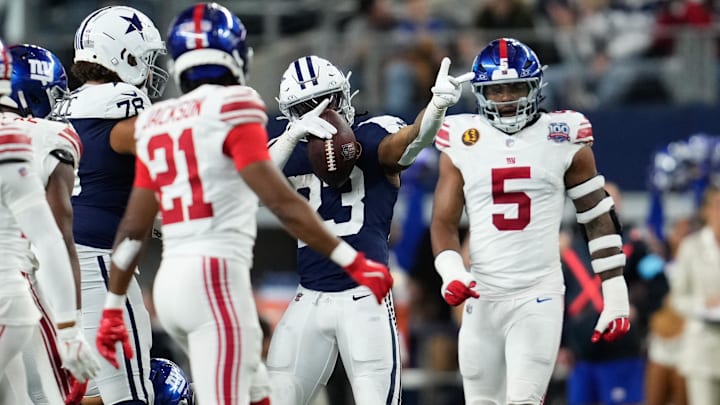 Nov 28, 2024; Arlington, Texas, USA;  Dallas Cowboys running back Rico Dowdle (23) celebrates after a first down run against the New York Giants during the second half at AT&T Stadium. Mandatory Credit: Chris Jones-Imagn Images