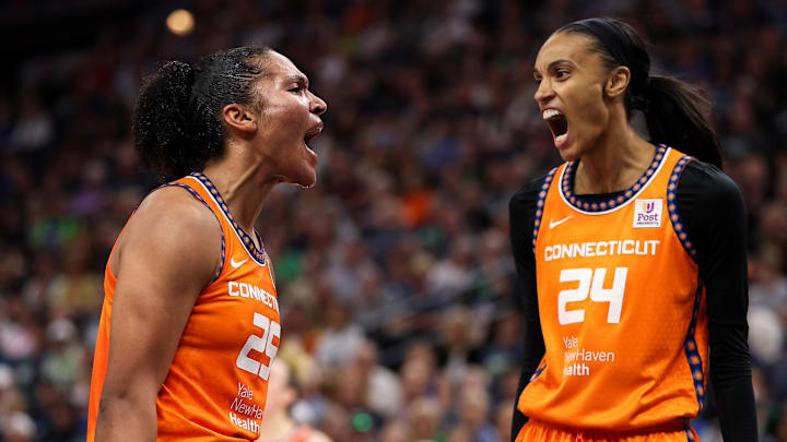 Connecticut Sun forward Alyssa Thomas (25) celebrates her shot with forward DeWanna Bonner.