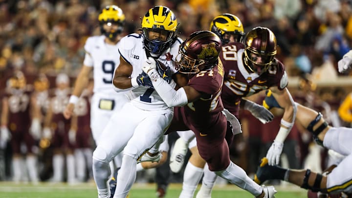 Oct 7, 2023; Minneapolis, Minnesota, USA; Michigan Wolverines running back Donovan Edwards (7) makes a catch while Minnesota Golden Gophers defensive back Tariq Watson (24) defends during the second quarter at Huntington Bank Stadium. Mandatory Credit: Matt Krohn-Imagn Images Oct 7, 2023; Minneapolis, Minnesota, USA; Michigan Wolverines running back Donovan Edwards (7) makes a catch while Minnesota Golden Gophers defensive back Tariq Watson (24) defends during the second quarter at Huntington Bank Stadium. Mandatory Credit: Matt Krohn-Imagn Images