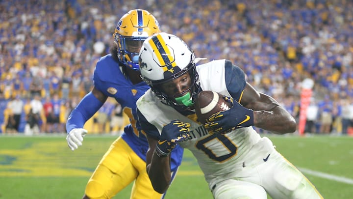 Bryce Ford-Wheaton (0) of the West Virginia Mountaineers hauls in a pass for a touchdown during the second half of the Backyard Brawl against the Pittsburgh Panthers at Acrisure Stadium in Pittsburgh, PA on September 1, 2022.

Pitt Vs West Virginia Backyard Brawl