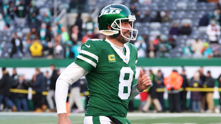 Jan 5, 2025; East Rutherford, New Jersey, USA; New York Jets quarterback Aaron Rodgers (8) runs onto the field for pregame warmups for their game against the Miami Dolphins at MetLife Stadium. Mandatory Credit: Ed Mulholland-Imagn Images Jan 5, 2025; East Rutherford, New Jersey, USA; New York Jets quarterback Aaron Rodgers (8) runs onto the field for pregame warmups for their game against the Miami Dolphins at MetLife Stadium. Mandatory Credit: Ed Mulholland-Imagn Images
