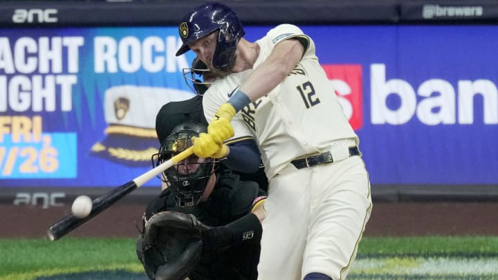 Milwaukee Brewers first baseman Rhys Hoskins (12) hits a solo home run during the fifth inning of their game against the Pittsburgh Pirates Wednesday, July 10, 2024 at American Family Field in Milwaukee, Wisconsin.
