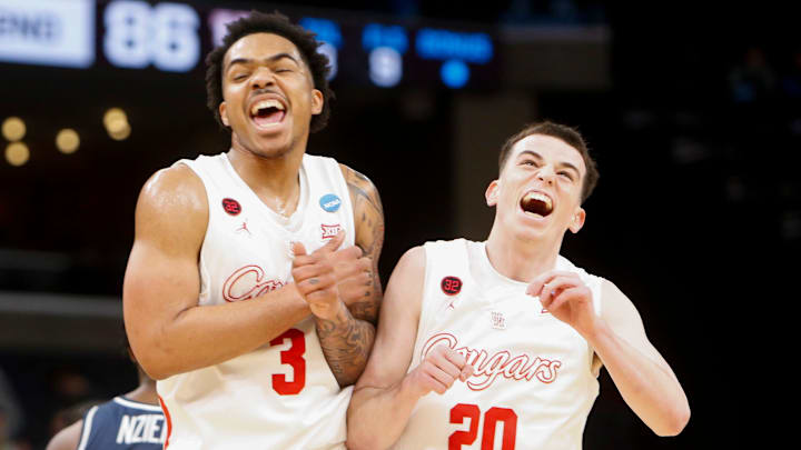 Houston's Ramon Walker Jr. (3) and Ryan Elvin (20)