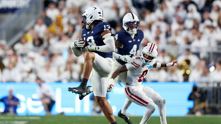 Penn State Nittany Lions linebacker Tony Rojas (13) intercepts the ball during the fourth quarter against the Wisconsin Badgers at Beaver Stadium. Penn State Nittany Lions linebacker Tony Rojas (13) intercepts the ball during the fourth quarter against the Wisconsin Badgers at Beaver Stadium.