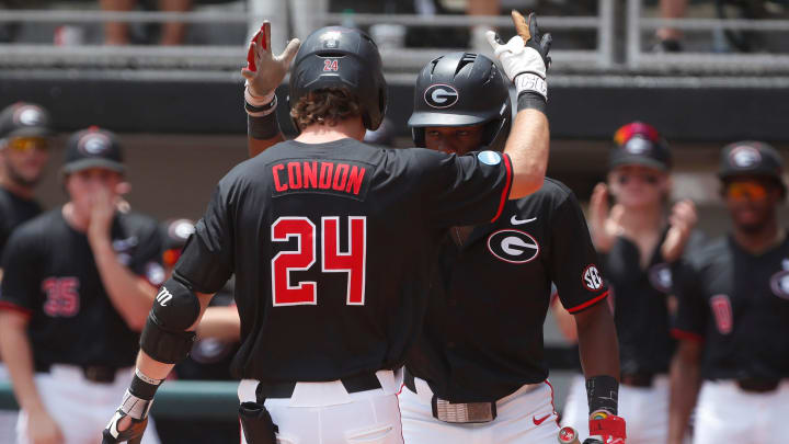 Georgia's Charlie Condon (24) celebrates with a teammate after hitting a home run during a NCAA Athens Regional baseball game against Army in Athens, Ga., on Friday, May 31, 2024.