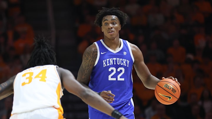 Jan 28, 2025; Knoxville, Tennessee, USA; Kentucky Wildcats center Amari Williams (22) brings the ball up court against Tennessee Volunteers forward Felix Okpara (34) during the second half at Thompson-Boling Arena at Food City Center. Mandatory Credit: Randy Sartin-Imagn Images