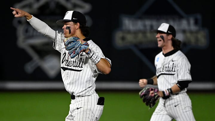 Vanderbilt's Rustan Rigdon (19) points to catcher Mike Mancini after Mancini threw out Louisville's Jake Munroe attempting to steal second base as Jonathan Vastine celebrates during the fourth inning of the Nashville Regional NCAA Baseball Tournament game at Hawkins Field Saturday, May 31, 2025, in Nashville, Tenn.