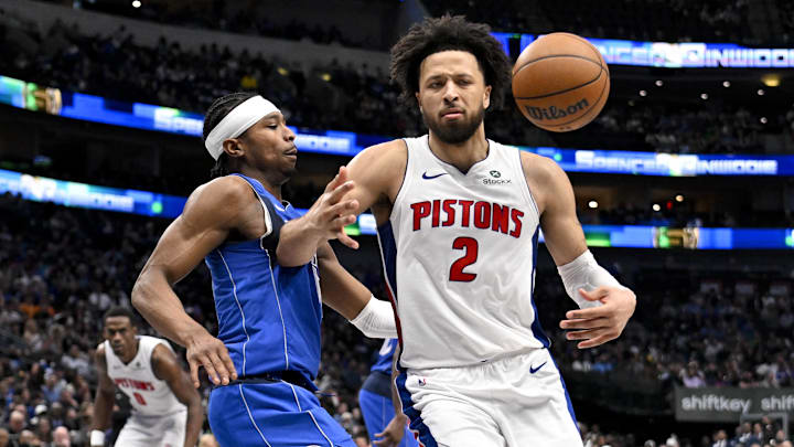 Mar 21, 2025; Dallas, Texas, USA; Dallas Mavericks guard Brandon Williams (10) knocks the ball away from Detroit Pistons guard Cade Cunningham (2) during the second half at the American Airlines Center. Mandatory Credit: Jerome Miron-Imagn Images