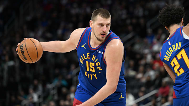 Feb 28, 2025; Detroit, Michigan, USA;  Denver Nuggets center Nikola Jokic (15) gets ready to drive to the basket against the Detroit Pistons  in the first quarter at Little Caesars Arena. Mandatory Credit: Lon Horwedel-Imagn Images