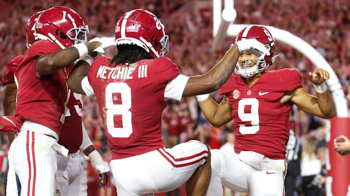 Bryce Young and John Metchie III celebrate a touchdown.

Tus Alabamatennesseegc1090