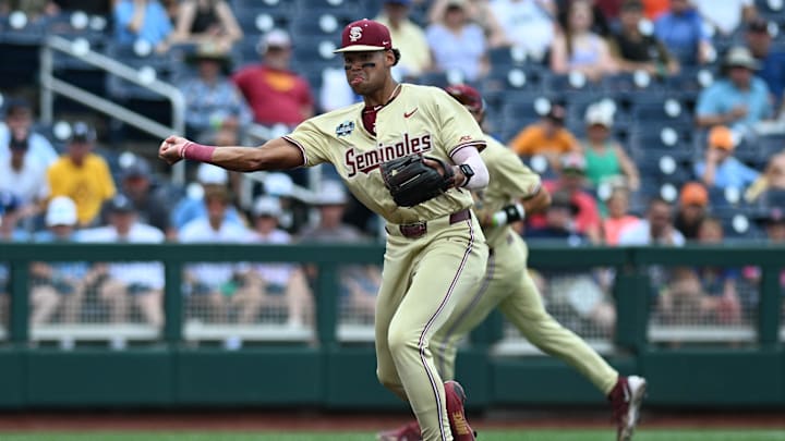 Jun 18, 2024; Omaha, NE, USA; Florida State Seminoles third baseman Cam Smith (24) throws to first base against the North Carolina Tar Heels during the first inning at Charles Schwab Field Omaha.