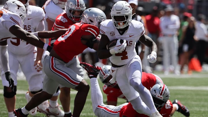 Texas Longhorns running back CJ Baxter (4) rushes the ball against the Ohio State Buckeyes in the first half at Ohio Stadium.