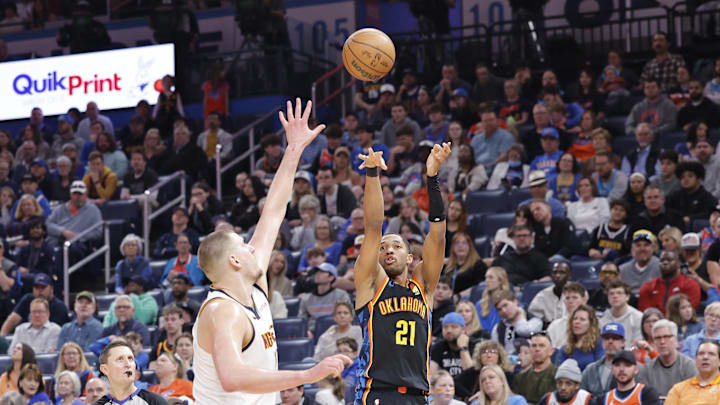 Mar 9, 2025; Oklahoma City, Oklahoma, USA; Oklahoma City Thunder guard Aaron Wiggins (21) shoots against the Denver Nuggets during the second half at Paycom Center. Mandatory Credit: Alonzo Adams-Imagn Images