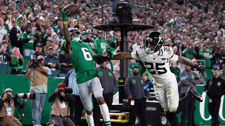 Nov 3, 2024; Philadelphia, Pennsylvania, USA; Philadelphia Eagles wide receiver DeVonta Smith (6) catches a touchdown pass in front of Jacksonville Jaguars cornerback Ronald Darby (25) during the fourth quarter at Lincoln Financial Field. Mandatory Credit: Bill Streicher-Imagn Images