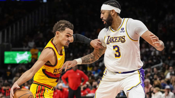 Jan 30, 2022; Atlanta, Georgia, USA; Atlanta Hawks guard Trae Young (11) dribbles against Los Angeles Lakers forward Anthony Davis (3) during the second half at State Farm Arena. Mandatory Credit: Dale Zanine-USA TODAY Sports