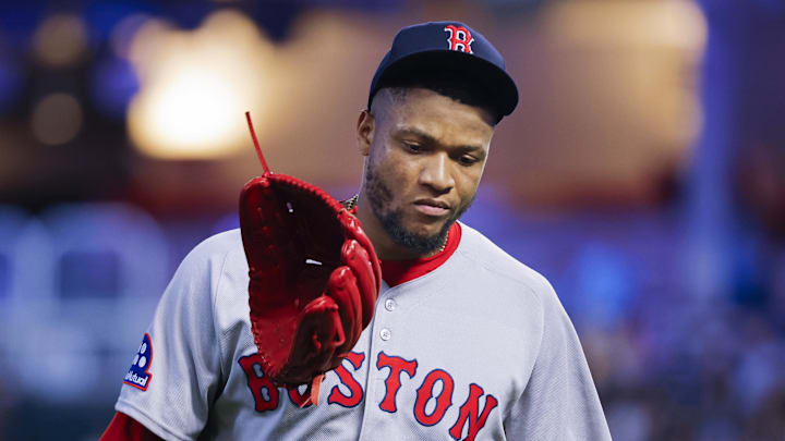 Jul 28, 2025; Minneapolis, Minnesota, USA; Boston Red Sox relief pitcher Jorge Alcala (71) flips his glove as he leaves the game against the Minnesota Twins in the sixth inning at Target Field. Mandatory Credit: Bruce Kluckhohn-Imagn Images