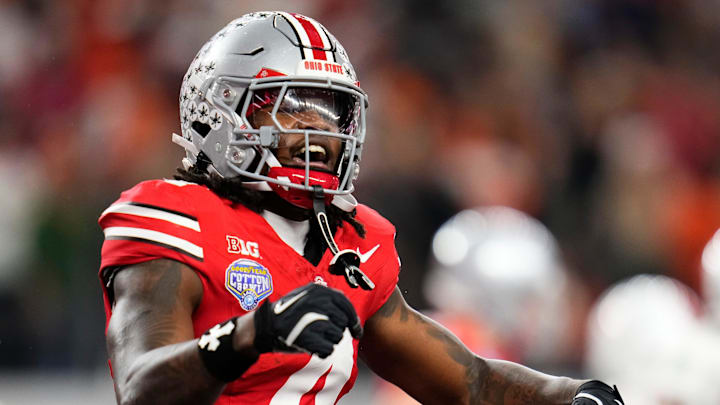 Ohio State Buckeyes wide receiver Jeremiah Smith (4) celebrates a touchdown during the Cotton Bowl at AT&T Stadium in Arlington, Texas for the College Football Playoff quarterfinal game against the Miami Hurricanes on Dec. 31, 2025. Ohio State lost 24-14.
