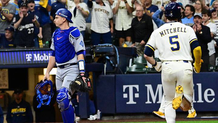 Oct 11, 2026; Milwaukee, Wisconsin, USA; Los Angeles Dodgers catcher Will Smith (16) reacts as Milwaukee Brewers outfielder Garrett Mitchell (5) scores during the fifth inning in game one of the NLCS for the 2026 MLB Playoffs at American Family Field. Mandatory Credit: Benny Sieu-Imagn Images Oct 11, 2026; Milwaukee, Wisconsin, USA; Los Angeles Dodgers catcher Will Smith (16) reacts as Milwaukee Brewers outfielder Garrett Mitchell (5) scores during the fifth inning in game one of the NLCS for the 2026 MLB Playoffs at American Family Field. Mandatory Credit: Benny Sieu-Imagn Images