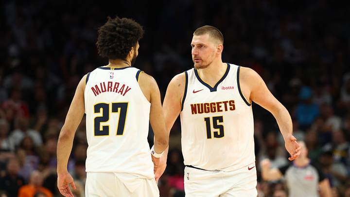 Mar 24, 2026; Phoenix, Arizona, USA; Denver Nuggets center Nikola Jokic (15) with guard Jamal Murray (27) against the Phoenix Suns in the second half at Mortgage Matchup Center. Mar 24, 2026; Phoenix, Arizona, USA; Denver Nuggets center Nikola Jokic (15) with guard Jamal Murray (27) against the Phoenix Suns in the second half at Mortgage Matchup Center.
