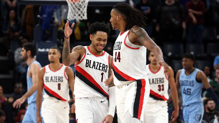 Mar 2, 2024; Memphis, Tennessee, USA; Portland Trail Blazers guard Anfernee Simons (1) reacts with forward Jabari Walker (34) at the end of regulation against the Memphis Grizzlies at FedExForum. Mandatory Credit: Petre Thomas-Imagn Images