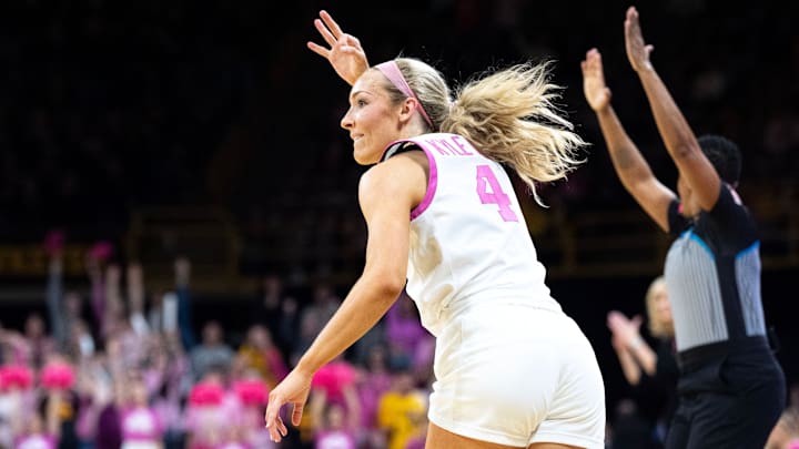 Iowa guard Kylie Feuerbach (4) reacts after making a 3-pointer against the Washington Huskies Feb. 11, 2026 at Carver-Hawkeye Arena in Iowa City, Iowa. Iowa guard Kylie Feuerbach (4) reacts after making a 3-pointer against the Washington Huskies Feb. 11, 2026 at Carver-Hawkeye Arena in Iowa City, Iowa.