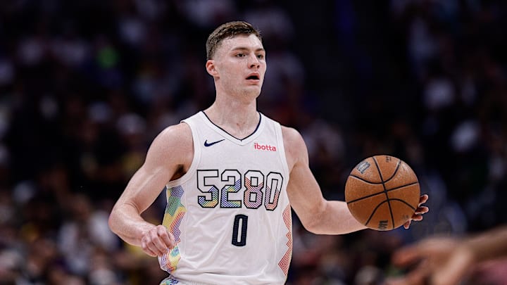 May 15, 2025; Denver, Colorado, USA; Denver Nuggets guard Christian Braun (0) dribbles the ball up court in the third quarter against the Oklahoma City Thunder during game six of the second round for the 2025 NBA Playoffs at Ball Arena. Mandatory Credit: Isaiah J. Downing-Imagn Images