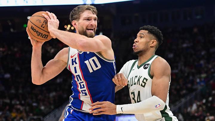 Jan 14, 2024; Milwaukee, Wisconsin, USA; Sacramento Kings center Domantas Sabonis (10) drives for the basket against Milwaukee Bucks forward Giannis Antetokounmpo (34) in the fourth quarter at Fiserv Forum. Mandatory Credit: Benny Sieu-Imagn Images