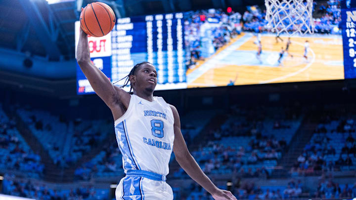 Nov 18, 2025; Chapel Hill, North Carolina, USA; North Carolina Tar Heels forward Caleb Wilson (8) goes up for a dunk against the Navy Midshipmen during the second half at Dean E. Smith Center. Mandatory Credit: Scott Kinser-Imagn Images