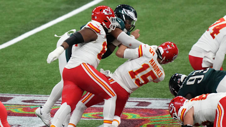 Feb 9, 2025; New Orleans, LA, USA; Kansas City Chiefs quarterback Patrick Mahomes (15) is sacked by Philadelphia Eagles defensive tackle Jalen Carter (98) and defensive tackle Milton Williams (93) during the fourth quarter in Super Bowl LIX at Caesars Superdome. Mandatory Credit: Kirby Lee-Imagn Images