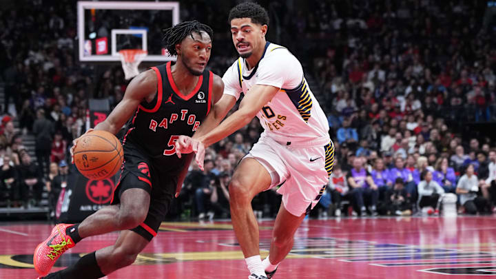 Nov 26, 2025; Toronto, Ontario, CAN; Toronto Raptors guard Immanuel Quickley (5) controls the ball as Indiana Pacers guard Ben Sheppard (26) tries to defend during the third quarter at Scotiabank Arena. Mandatory Credit: Nick Turchiaro-Imagn Images
