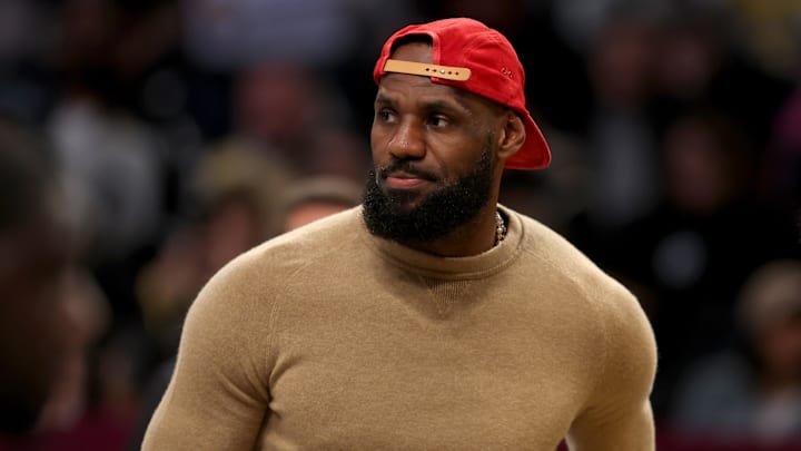 Mar 10, 2025; Brooklyn, New York, USA; Los Angeles Lakers injured forward LeBron James (23) on the court during a time out during the first quarter against the Brooklyn Nets at Barclays Center. Mandatory Credit: Brad Penner-Imagn Images