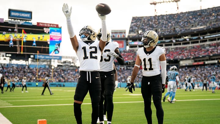 New Orleans Saints wide receiver Chris Olave (12) celebrates his touchdown against the Tennessee Titans during the third quarter at Nissan Stadium in Nashville, Tenn., Sunday, Dec. 28, 2025.
