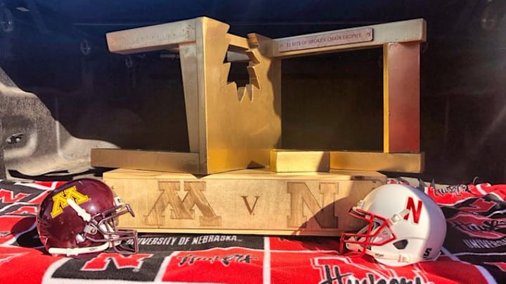 The $5 Bits of Broken Chair Trophy with mini helmets for Minnesota and Nebraska.