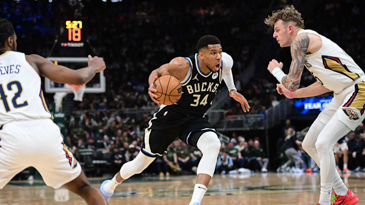 Apr 10, 2025; Milwaukee, Wisconsin, USA: Milwaukee Bucks forward Giannis Antetokounmpo (34) drives for the basket against New Orleans Pelicans center Kylor Kelley (35) in the third quarter at Fiserv Forum. Mandatory Credit: Benny Sieu-Imagn Images