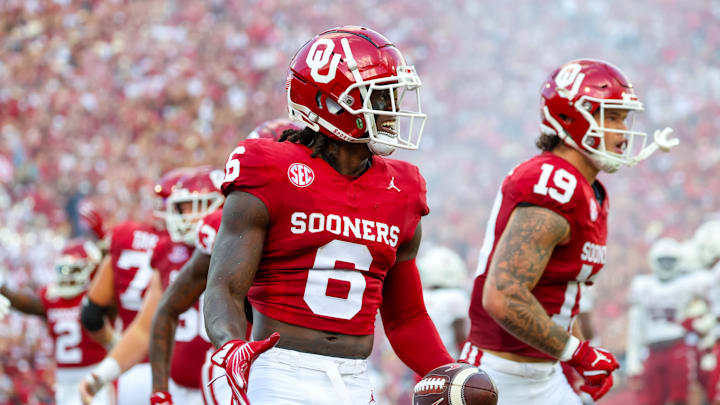 Aug 30, 2024; Norman, Oklahoma, USA;  Oklahoma Sooners wide receiver Deion Burks (6) celebrates after scoring during the first quarter against the Temple Owls at Gaylord Family-Oklahoma Memorial Stadium. Mandatory Credit: Kevin Jairaj-Imagn Images