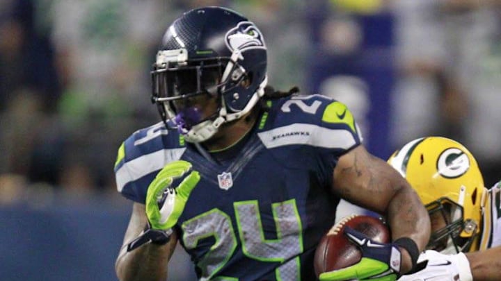 Seattle Seahawks running back Marshawn Lynch (24) runs for a 1st down past Green Bay Packers inside linebacker Brad Jones (59) during the 4th quarter of the Green Bay Packers game against the Seattle Seahawks Thursday, September 4, 2014 at CenturyLink Field in Seattle, Wash. Seattle Seahawks running back Marshawn Lynch (24) runs for a 1st down past Green Bay Packers inside linebacker Brad Jones (59) during the 4th quarter of the Green Bay Packers game against the Seattle Seahawks Thursday, September 4, 2014 at CenturyLink Field in Seattle, Wash.