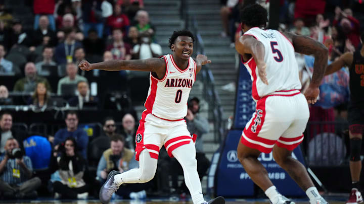 Mar 14, 2024; Las Vegas, NV, USA; Arizona Wildcats guard Jaden Bradley (0) and guard KJ Lewis (5) celebrate against the Southern California Trojans in the second half at T-Mobile Arena Mar 14, 2024; Las Vegas, NV, USA; Arizona Wildcats guard Jaden Bradley (0) and guard KJ Lewis (5) celebrate against the Southern California Trojans in the second half at T-Mobile Arena