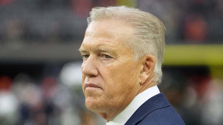 Denver Broncos president of football operations John Elway watches from the sidelines.