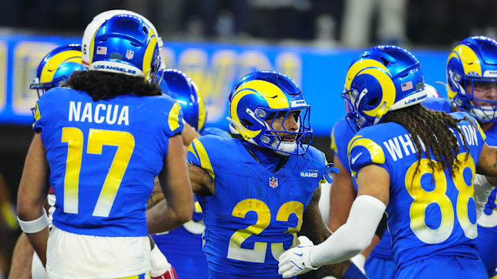 Dec 28, 2024; Inglewood, California, USA; Los Angeles Rams running back Kyren Williams (23) celebrates with wide receiver Jordan Whittington (88) and wide receiver Puka Nacua (17) after scoring on a 1-yard touchdown run against the Arizona Cardinals in the first half at SoFi Stadium. Mandatory Credit: Kirby Lee-Imagn Images Dec 28, 2024; Inglewood, California, USA; Los Angeles Rams running back Kyren Williams (23) celebrates with wide receiver Jordan Whittington (88) and wide receiver Puka Nacua (17) after scoring on a 1-yard touchdown run against the Arizona Cardinals in the first half at SoFi Stadium. Mandatory Credit: Kirby Lee-Imagn Images
