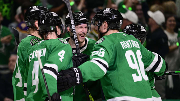May 21, 2025; Dallas, Texas, USA; Dallas Stars defenseman Miro Heiskanen (4) and center Roope Hintz (24) and defenseman Esa Lindell (23) and center Mikael Granlund (64) and right wing Mikko Rantanen (96) celebrates the empty net goal scored by Lindell against the Edmonton Oilers in game one of the Western Conference Final of the 2025 Stanley Cup Playoffs at American Airlines Center. Mandatory Credit: Jerome Miron-Imagn Images