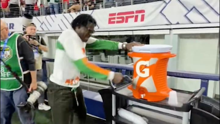 Michael Irvin took a belt to a Gatorade jug after Miami beat Ohio State. Michael Irvin took a belt to a Gatorade jug after Miami beat Ohio State.