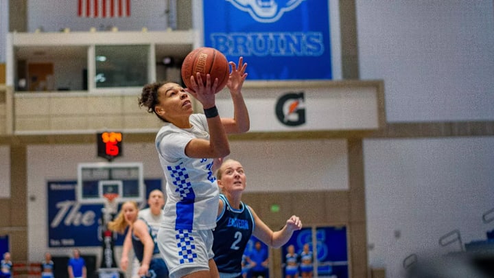 Salt Lake City Community College Guard Tahys Da Silva (25) drives to the basket vs Utah State Eastern Guard Avery Sanders (2). In Bruins 63-49 win over the Eagles from Feb 6th, 2025. 