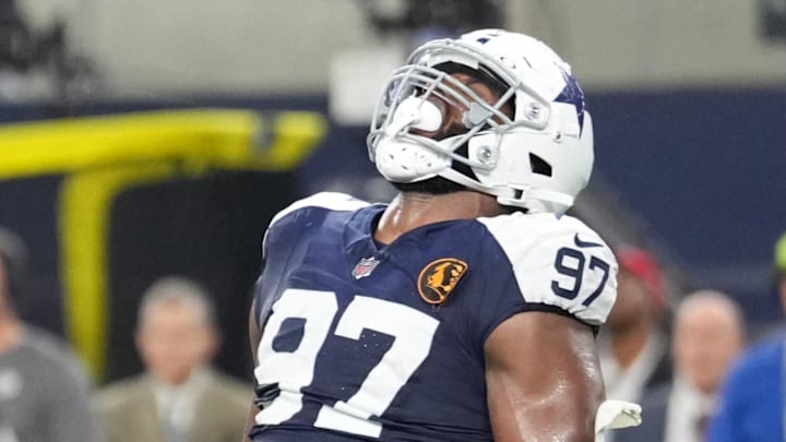 Nov 28, 2024; Arlington, Texas, USA; Dallas Cowboys defensive tackle Osa Odighizuwa (97) celebrates after a sack against the New York Giants during the second half at AT&T Stadium. Mandatory Credit: Chris Jones-Imagn Images Nov 28, 2024; Arlington, Texas, USA; Dallas Cowboys defensive tackle Osa Odighizuwa (97) celebrates after a sack against the New York Giants during the second half at AT&T Stadium. Mandatory Credit: Chris Jones-Imagn Images