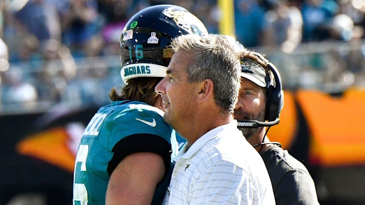 Oct 10, 2021; Jacksonville, FL, USA;   Jacksonville Jaguars head coach Urban Meyer congratulates quarterback Trevor Lawrence (16) after he scored a touchdown against the Tennessee Titans at TIAA Bank Field Sunday, Oct. 10, 2021.