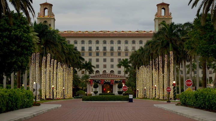 The palm lights on the main drive at The Breakers Palm Beach are illuminated in December 2020. The Breakers team spent six days decorating the luxury resort in Palm Beach.