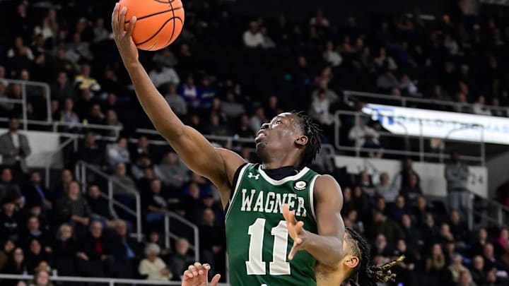 Nov 28, 2023; Providence, Rhode Island, USA; Wagner Seahawks guard Melvin Council Jr. (11) goes for a lay-up against Providence. 